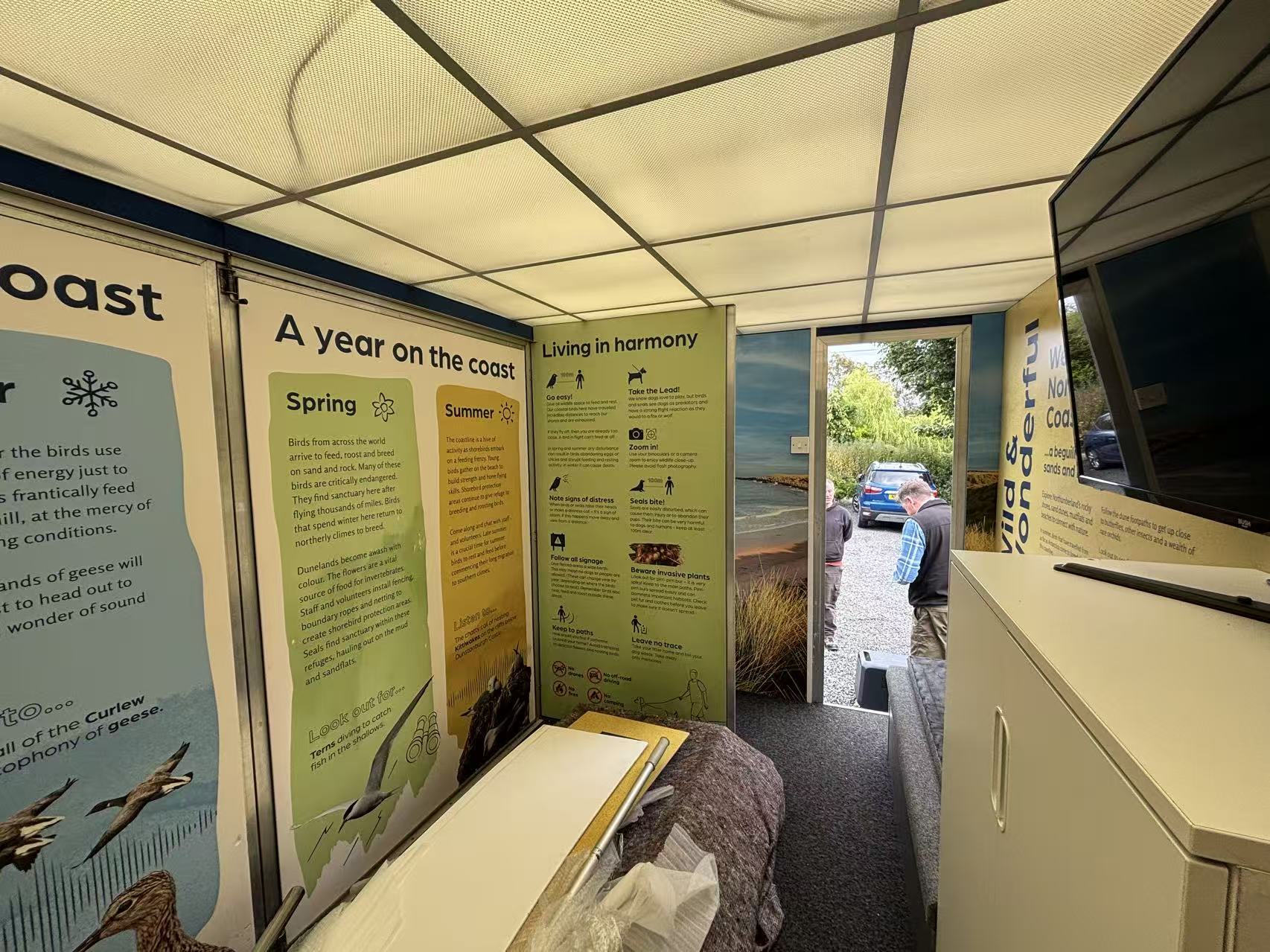 Inside the interpretation wagon, with seasonal wildlife panels and visitor guidance