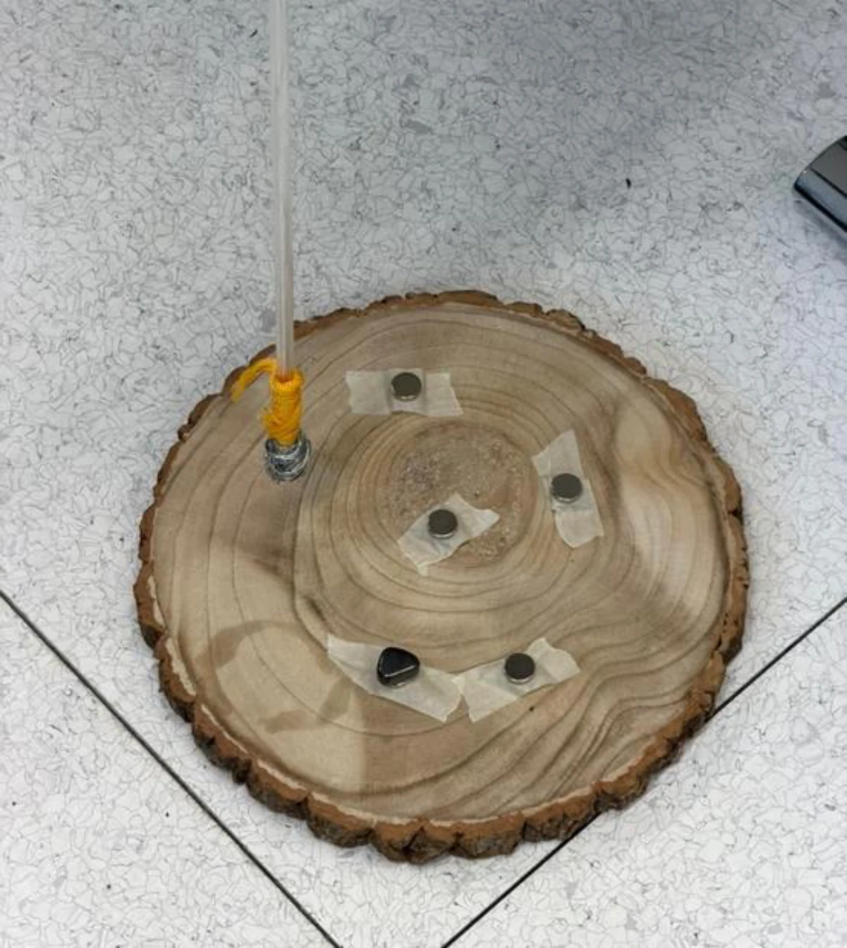 Early magnetic pendulum prototype used to compare magnet arrangements