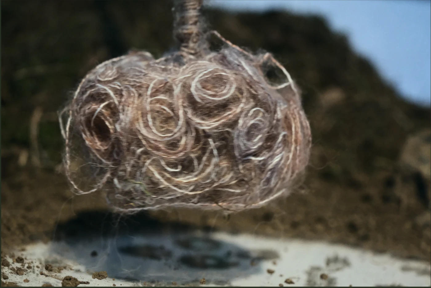 The suspended yarn form above the installation